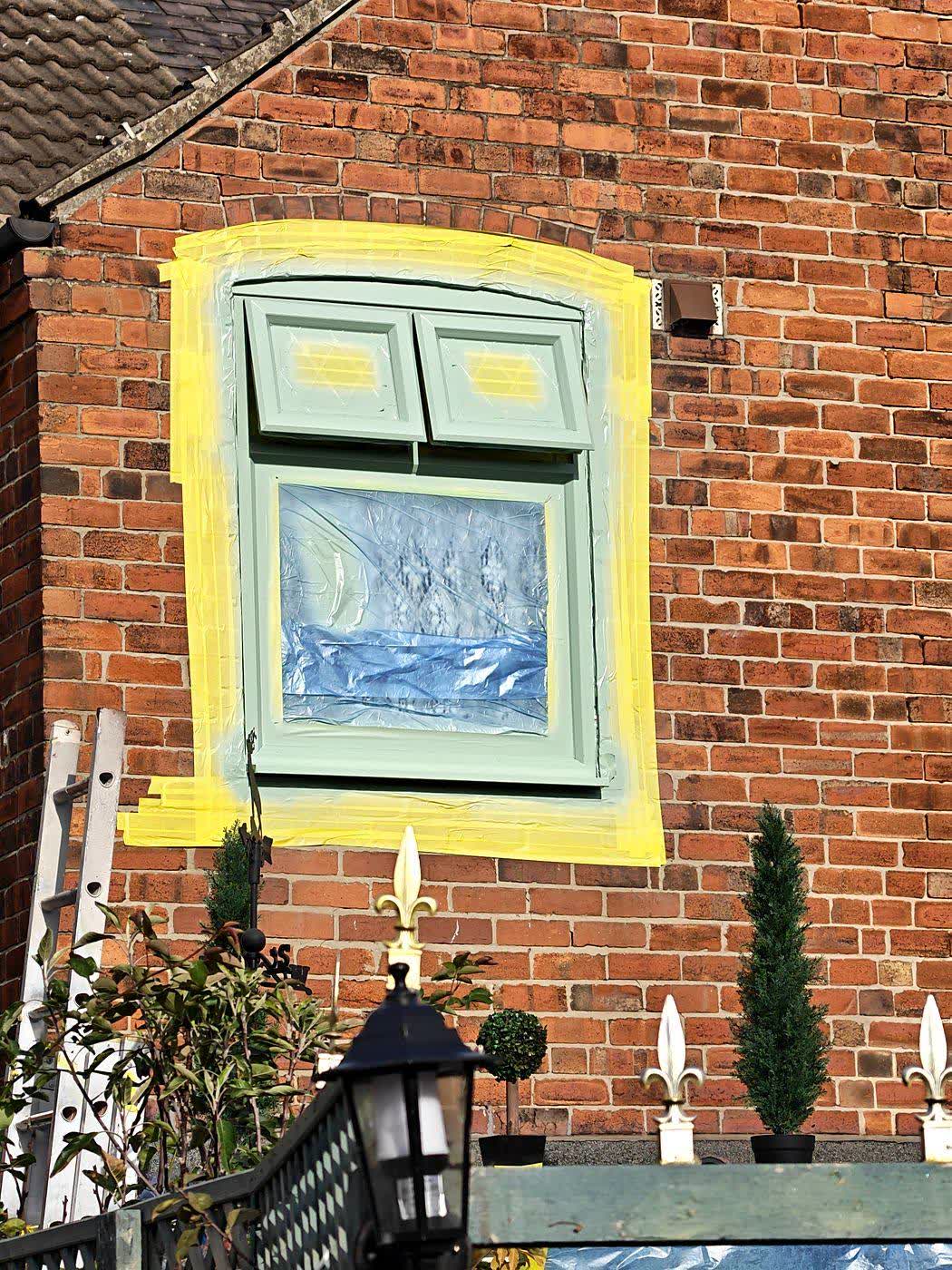 Finished sage green bay window on red brick