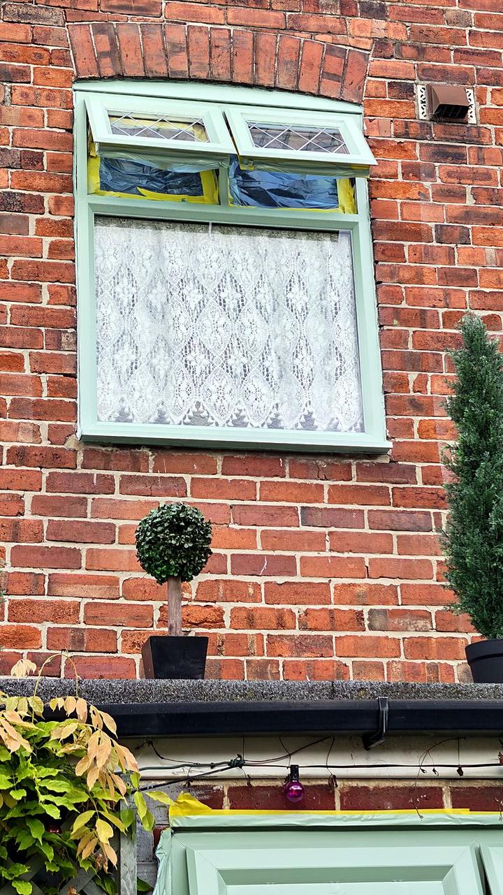 Close-up of a resprayed leaded window in sage