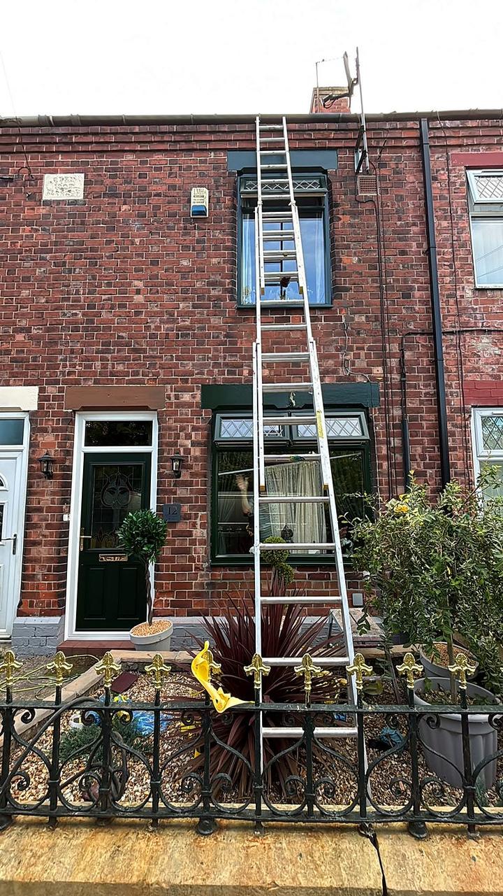 Red-brick terrace with ladder during spraying