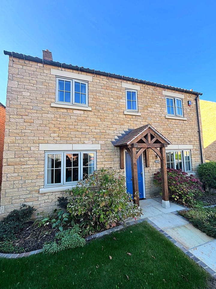 Wooden windows: RAL 9001 Cream, stone house with timber windows resprayed cream white